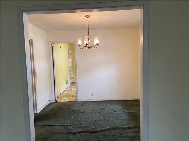 unfurnished dining area with a chandelier