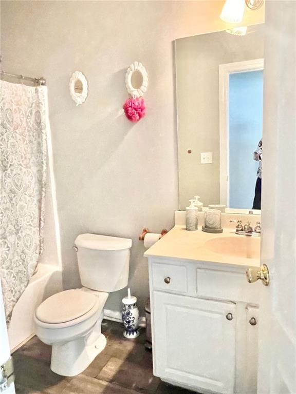 full bathroom with toilet, shower / bath combo, vanity, and wood-type flooring