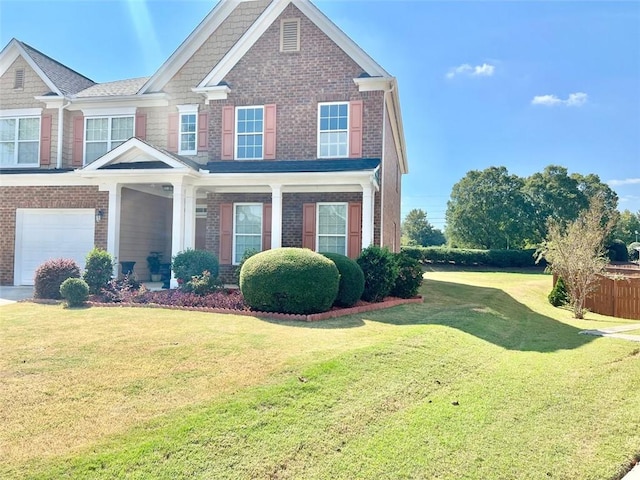 view of front of property featuring a garage and a front lawn