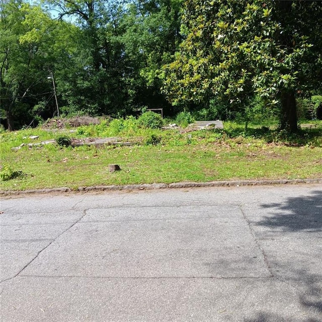 2637 Johnson St, Lithonia, GA 30058 - view of asphalt road featuring curbs