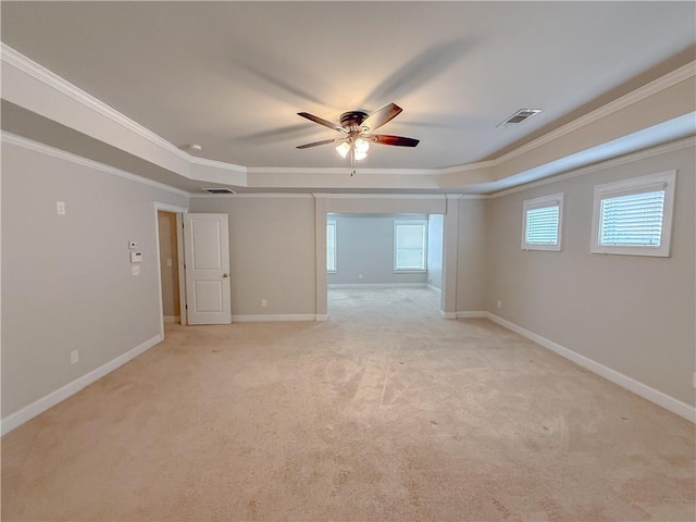 carpeted empty room with ornamental molding and ceiling fan