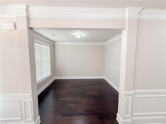 unfurnished room with crown molding and wood-type flooring