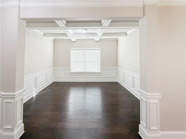 unfurnished room featuring beamed ceiling, coffered ceiling, dark wood-type flooring, and ornamental molding