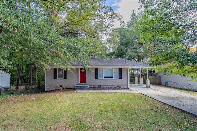 view of front facade with a front lawn and a carport