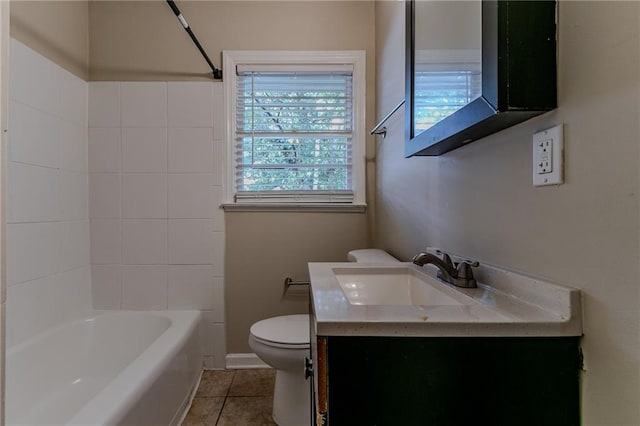 full bathroom featuring toilet, washtub / shower combination, vanity, and tile patterned flooring