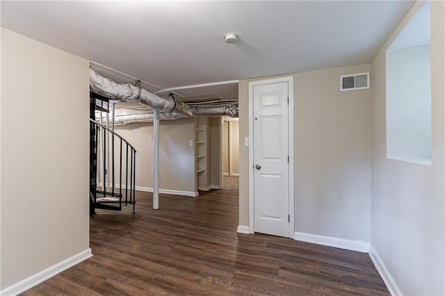 basement featuring dark hardwood / wood-style floors