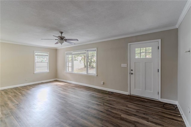 foyer entrance featuring a textured ceiling, dark wood-type flooring, ceiling fan, and crown molding