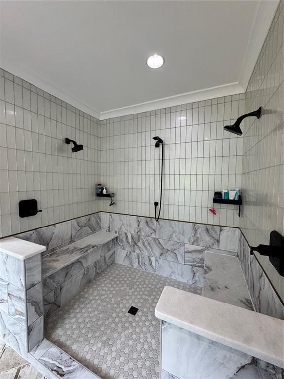 full bath featuring ornamental molding and tiled shower