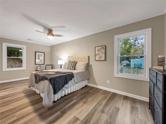 bedroom featuring ceiling fan and hardwood / wood-style flooring