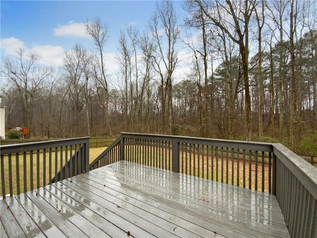 wooden deck with a lawn