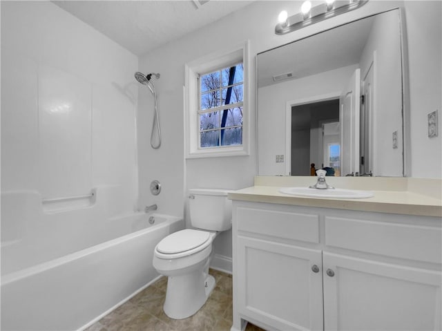 bathroom with toilet, tub / shower combination, vanity, and visible vents