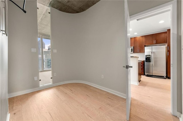 855 Peachtree St NE Unit 3205, Atlanta, GA 30308 - empty room featuring light wood-type flooring, baseboards, and recessed lighting