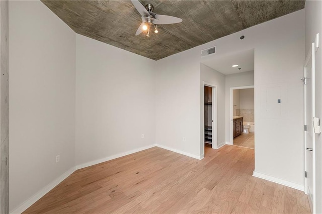 855 Peachtree St NE Unit 3205, Atlanta, GA 30308 - spare room featuring light wood-type flooring, ceiling fan, and baseboards