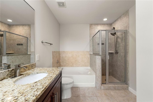 855 Peachtree St NE Unit 3205, Atlanta, GA 30308 - full bath featuring a stall shower, vanity, a garden tub, tile patterned floors, and toilet