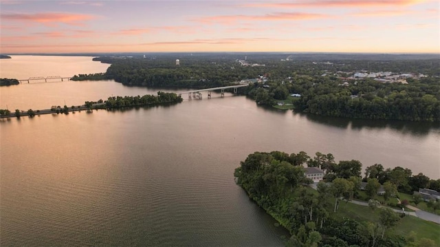 aerial view at dusk with a water view