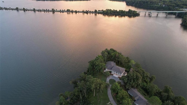 aerial view at dusk with a water view