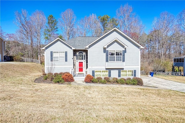 raised ranch featuring a front lawn