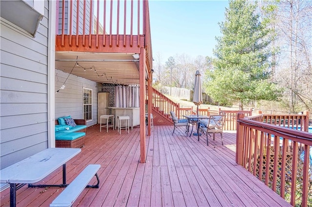 wooden deck featuring outdoor dining space