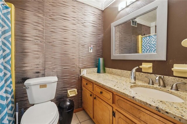 bathroom with tile patterned floors, a shower with curtain, vanity, and toilet