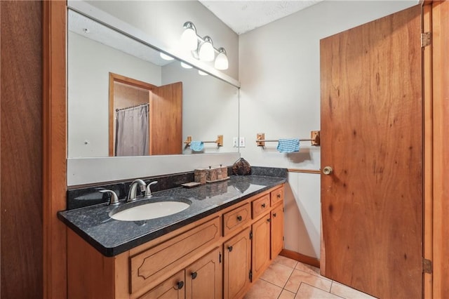 bathroom featuring vanity and tile patterned flooring