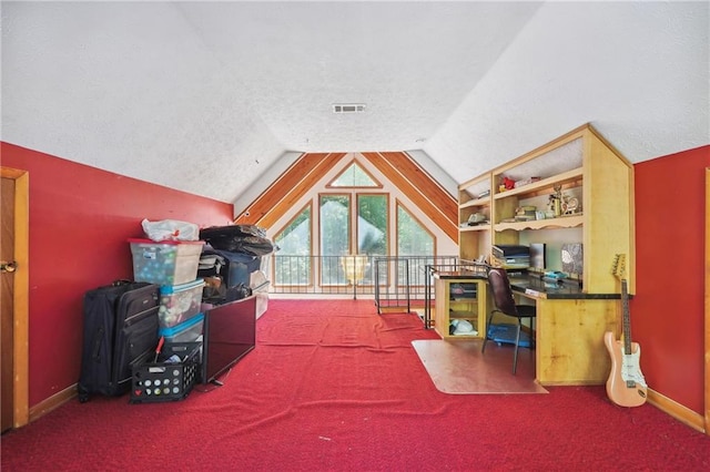 recreation room with a textured ceiling, lofted ceiling, and carpet flooring