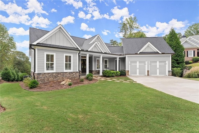 craftsman inspired home with a front lawn