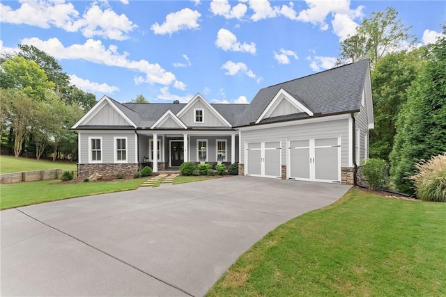 craftsman inspired home featuring a porch and a front lawn