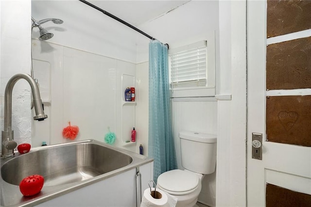 full bathroom with toilet, shower / bath combo, and sink