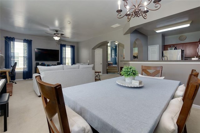 2968 Oshields Ct SW Unit 4, Marietta, GA 30060 - dining room with arched walkways, light carpet, ceiling fan, and a chandelier