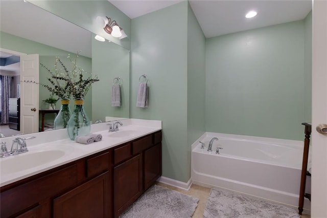 2968 Oshields Ct SW Unit 4, Marietta, GA 30060 - bathroom featuring double vanity, a garden tub, baseboards, and tile patterned flooring