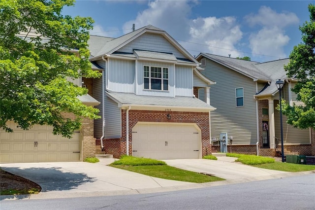 2968 Oshields Ct SW Unit 4, Marietta, GA 30060 - view of front of property featuring board and batten siding, concrete driveway, brick siding, and a garage