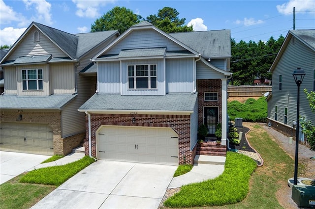 2968 Oshields Ct SW Unit 4, Marietta, GA 30060 - view of front of property with brick siding, an attached garage, board and batten siding, and concrete driveway