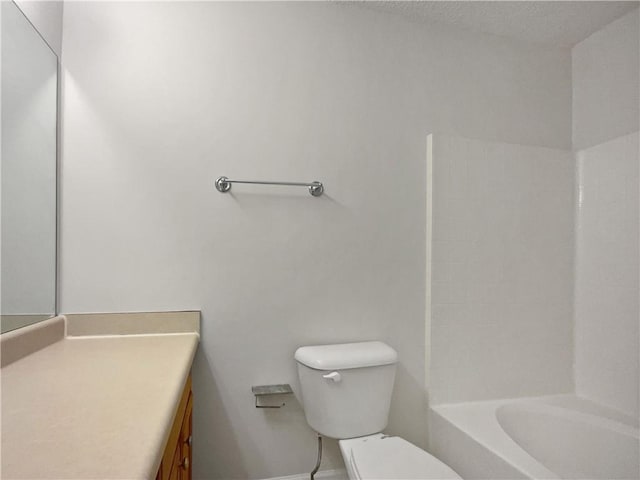 full bathroom with vanity, shower / bathtub combination, and toilet