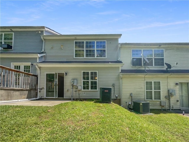 back of property featuring a yard, a patio, and central AC