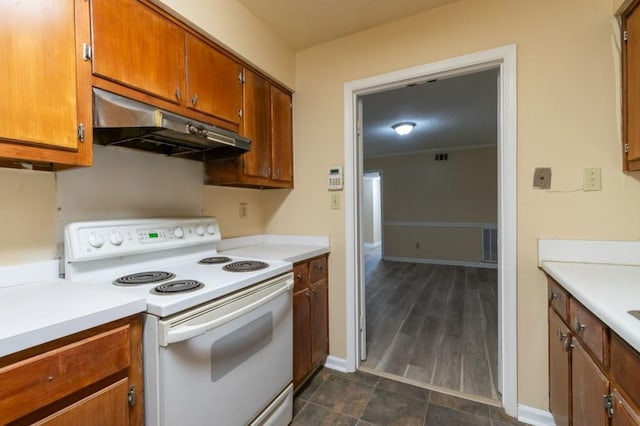 kitchen featuring white range with electric cooktop, under cabinet range hood, light countertops, brown cabinets, and baseboards