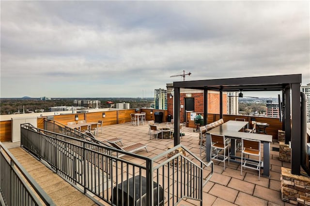 view of patio / terrace with a city view and outdoor dining space