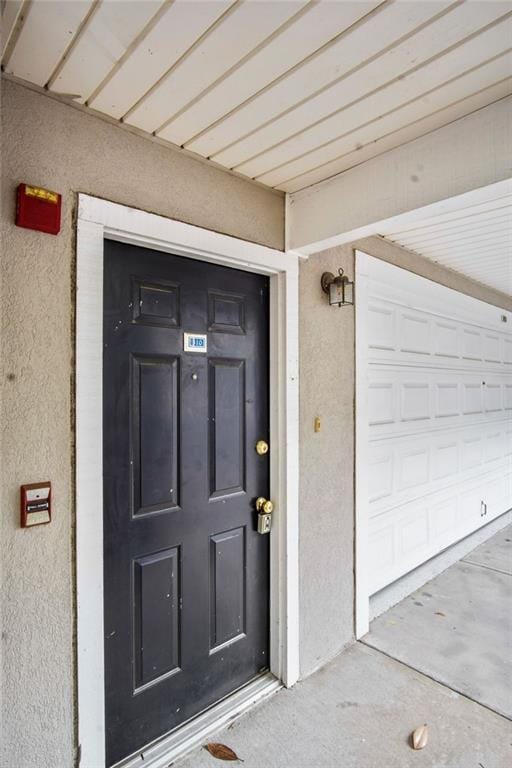 entrance to property featuring a garage