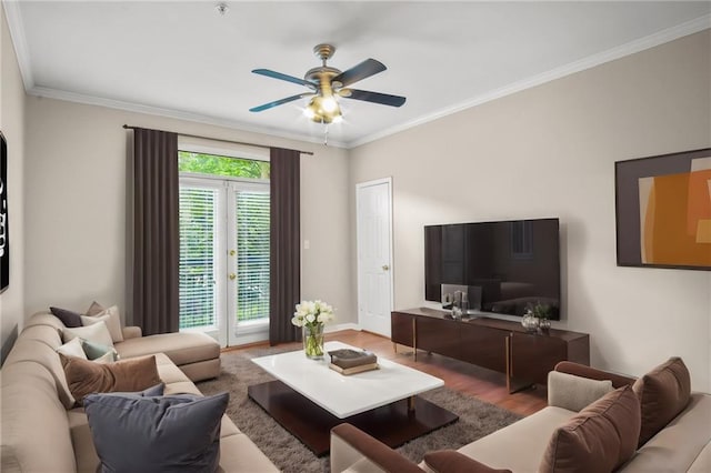 living room featuring french doors, hardwood / wood-style flooring, ceiling fan, and crown molding