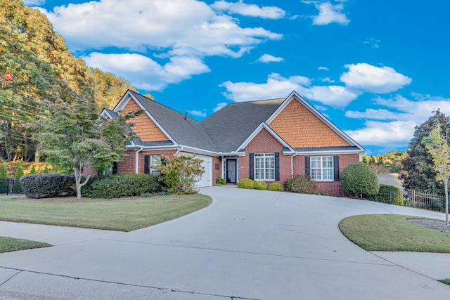 view of front of property featuring a front yard and a garage