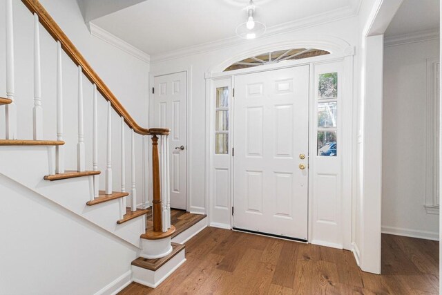 6 Stratford Hall Pl NE, Atlanta, GA 30342 - entryway with wood finished floors, ornamental molding, baseboards, and stairway