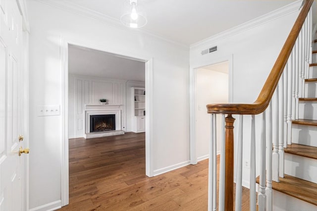 6 Stratford Hall Pl NE, Atlanta, GA 30342 - hallway with wood finished floors, stairway, ornamental molding, and baseboards