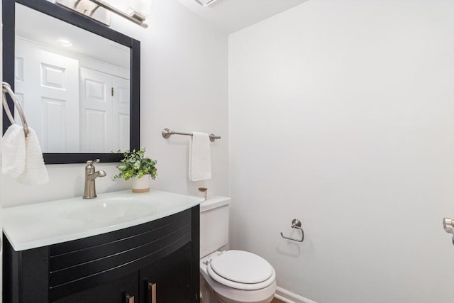6 Stratford Hall Pl NE, Atlanta, GA 30342 - bathroom with vanity, toilet, and baseboards