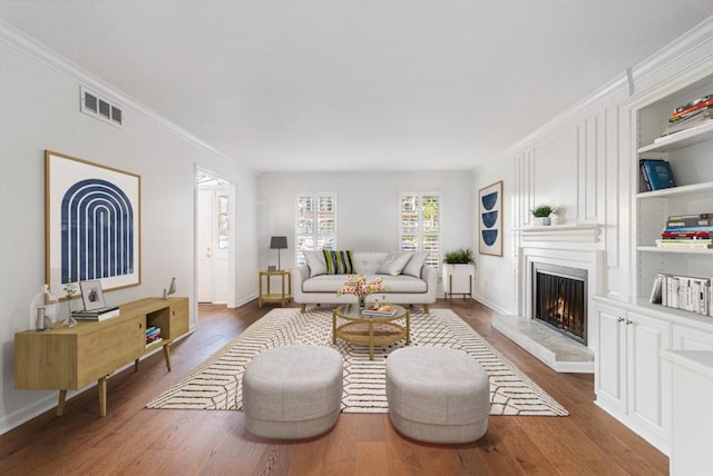 6 Stratford Hall Pl NE, Atlanta, GA 30342 - living room with dark wood-type flooring, a fireplace, crown molding, and baseboards