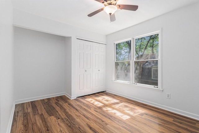 6 Stratford Hall Pl NE, Atlanta, GA 30342 - unfurnished bedroom featuring wood finished floors, baseboards, and a closet