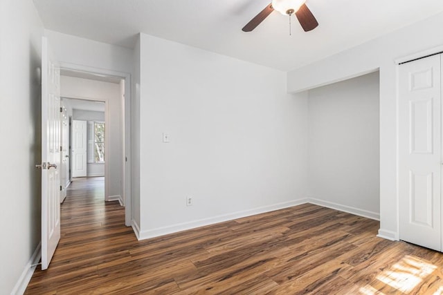 6 Stratford Hall Pl NE, Atlanta, GA 30342 - unfurnished bedroom featuring dark wood-style flooring, baseboards, and ceiling fan