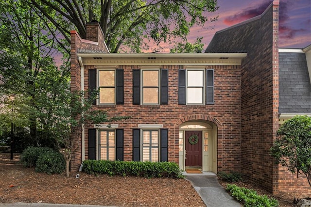6 Stratford Hall Pl NE, Atlanta, GA 30342 - view of front facade with brick siding and a chimney