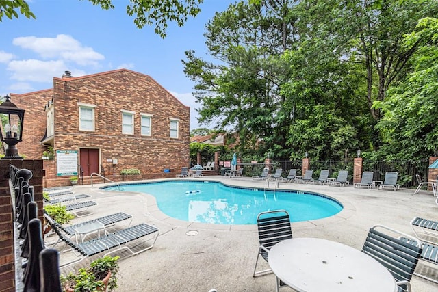 6 Stratford Hall Pl NE, Atlanta, GA 30342 - community pool featuring a patio area