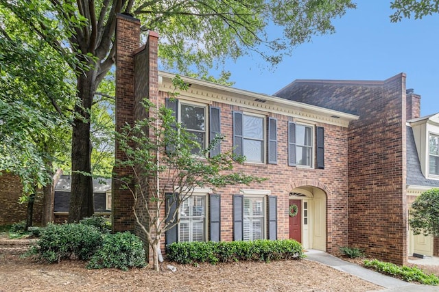 6 Stratford Hall Pl NE, Atlanta, GA 30342 - view of front of property featuring brick siding and a chimney