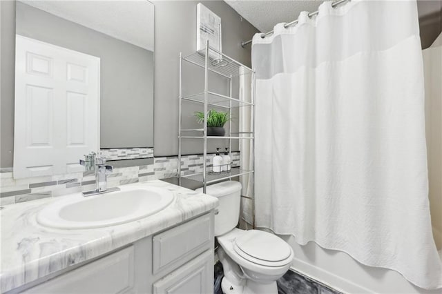 bathroom with tasteful backsplash, toilet, vanity, a textured ceiling, and shower / bath combination with curtain