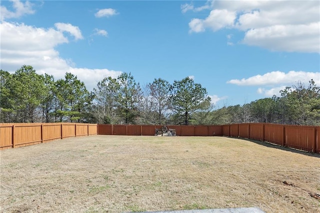 view of yard with a fenced backyard